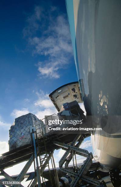 Cargo being loaded into rear side cargo door of a Korean Air Lines Boeing 747-200F.