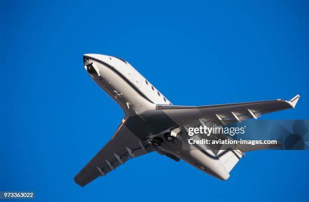 Bombardier Challenger Cl-600 taking-off with undercarriage retracting.