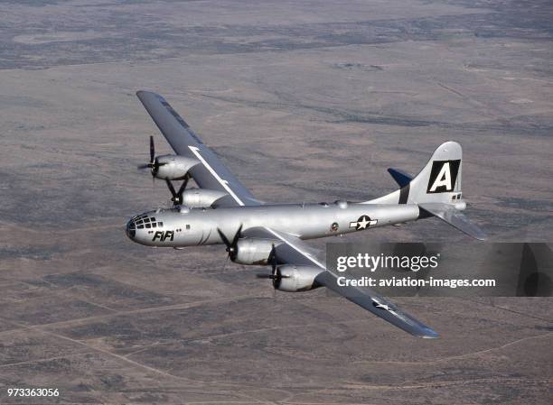 Boeing B-29 Super Fortress named 'FiFi' flying over a desert landscape at the 1997 Confederate-Air-Force Airshow.