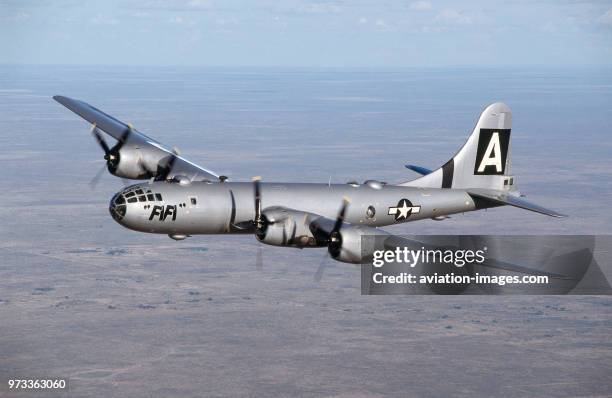 Boeing B-29 Super Fortress named 'FiFi' flying over a desert landscape.