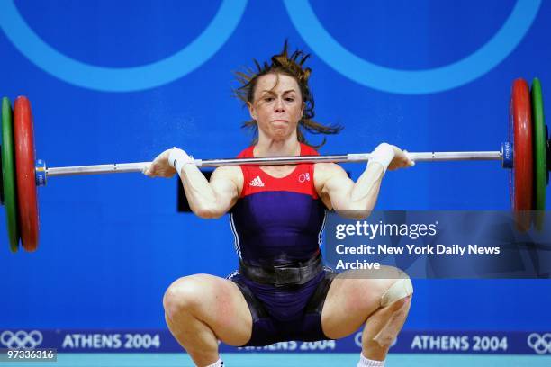 Weightlifter Tara Nott Cunningham of the United States is unable to lift 80 kilograms on her second snatch attempt during the 48-kilogram class...