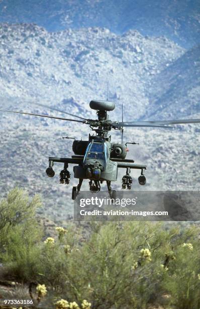 Army Boeing AH-64D Apache Longbow low-flying over the Four Peaks desert area of Tonto National Forest, flown by test pilot - Pete Nicholson.