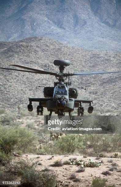 Army Boeing AH-64D Apache Longbow low-flying over the Four Peaks desert area of Tonto National Forest, flown by test pilot - Pete Nicholson.