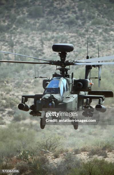 Army Boeing AH-64D Apache Longbow low-flying over the Four Peaks desert area of Tonto National Forest, flown by test pilot - Pete Nicholson.