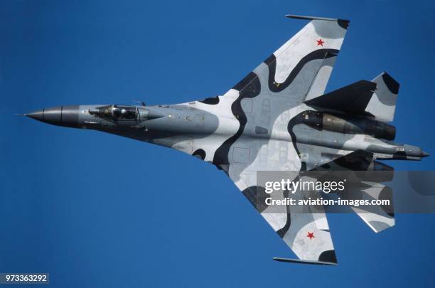 Sukhoi Su-27 Flanker in the flying-display at the 1999 Moscow Zhukovskiy Airshow banking in a steep turn with inboard ailerons deployed.