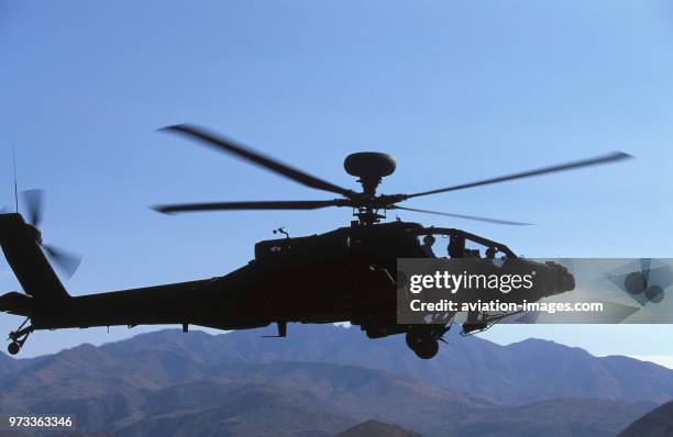 Army Boeing AH-64D Apache Longbow low-flying over the Four Peaks desert area of Tonto National Forest, flown by test pilot - Pete Nicholson.