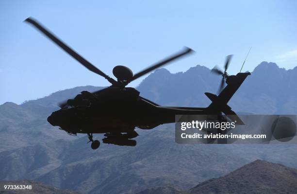 Army Boeing AH-64D Apache Longbow low-flying over the Four Peaks desert area of Tonto National Forest, flown by test pilot - Pete Nicholson.