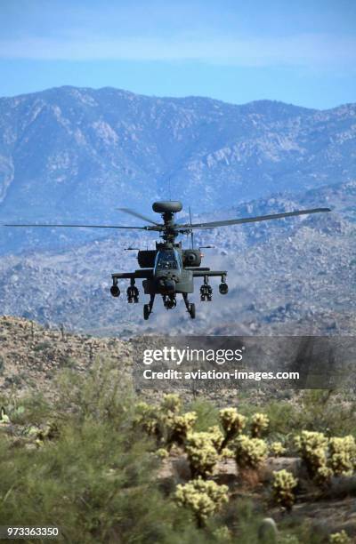 Army Boeing AH-64D Apache Longbow low-flying over the Four Peaks desert area of Tonto National Forest, flown by test pilot - Pete Nicholson.