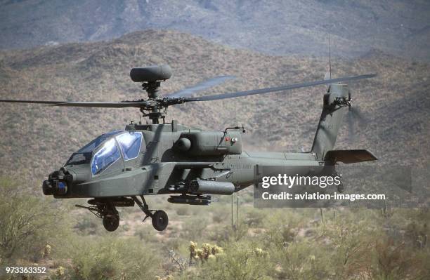 Army Boeing AH-64D Apache Longbow low-flying over the Four Peaks desert area of Tonto National Forest, flown by test pilot - Pete Nicholson.