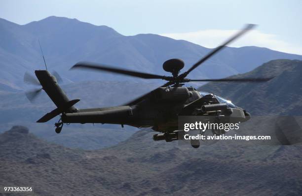 Army Boeing AH-64D Apache Longbow low-flying over the Four Peaks desert area of Tonto National Forest, flown by test pilot - Pete Nicholson.