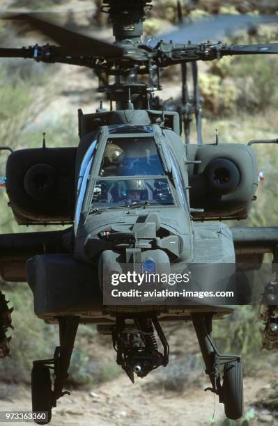 Army Boeing AH-64D Apache Longbow low-flying over the Four Peaks desert area of Tonto National Forest, flown by test pilot - Pete Nicholson.