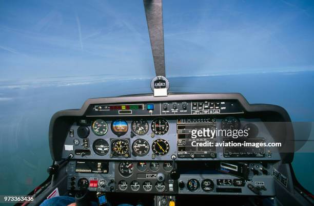 Robin DR-400-180 Regent cockpit instrument-panel with early generation GPS and artificial-horizon on a clear day.