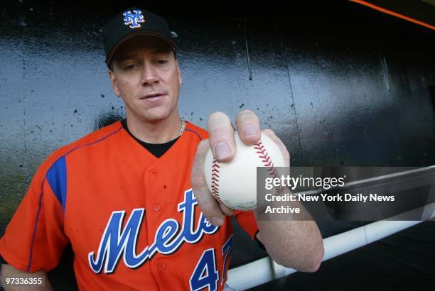 New York Mets' pitcher Tom Glavine displays his grip on the baseball for his changeup pitch at the team's spring training camp in Port St. Lucie,...