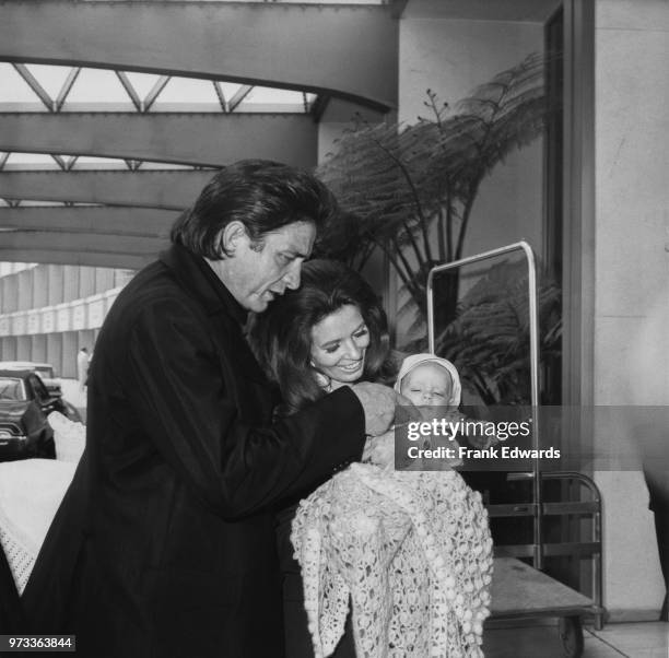 American singer-songwriter Johnny Cash and his wife, June Carter Cash with their baby son, John Carter Cash, 1970.