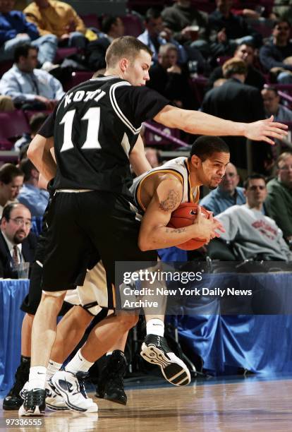 West Virginia Mountaineers' guard Jarmon Durisseau-Collins tries to get around Providence Friars' Tuukka Kotti during second half action at Madison...