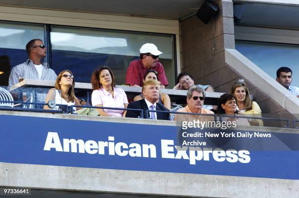 Donald Trump watches a semifinal match between Maria Sharapova of Russia and Kim Clijsters of Belgium at Arthur Ashe Stadium during the U.S. Open in...