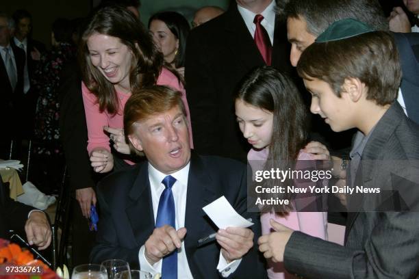 Donald Trump has an autograph and a few words for youngsters at a Children at Heart gala benefiting the Children of Chernobyl Relief Fund at Pier 60,...