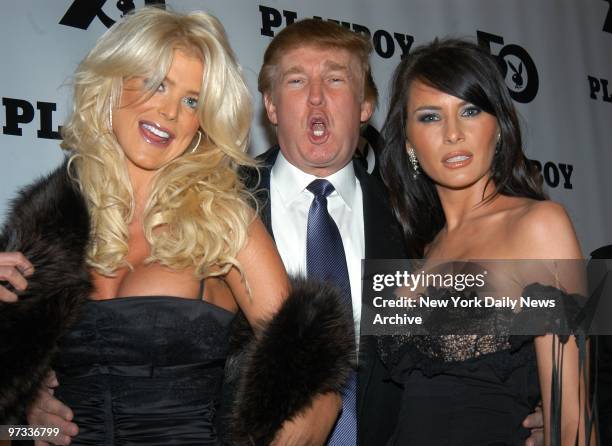 Donald Trump is flanked by Victoria Silvstedt, 1997 Playmate of the Year, and his girlfriend, Melania Knauss, at Playboy magazine's 50th anniversary...