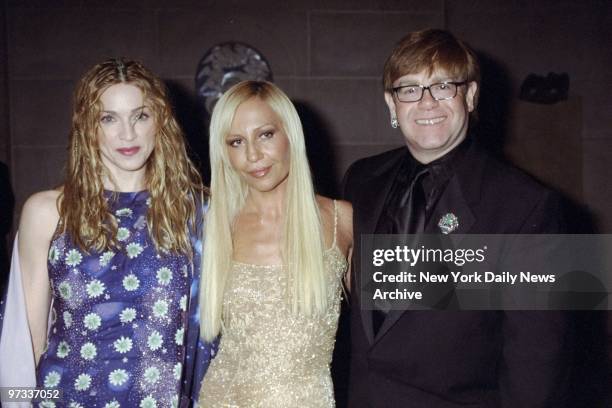 Donatella Versace is joined by Madonna and Elton John at the Metropolitan Museum of Art Costume Institute gala, where the Gianni Versace Exhibition...