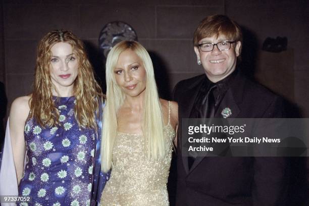Donatella Versace is joined by Madonna and Elton John at the Metropolitan Museum of Art Costume Institute gala, where the Gianni Versace Exhibition...
