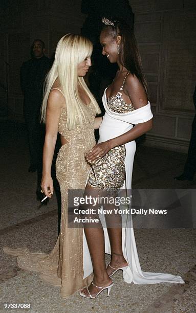 Donatella Versace is greeted by Iman at Metropolitan Museum of Art Costume Institute gala to introduce Gianni Versace Exhibition.