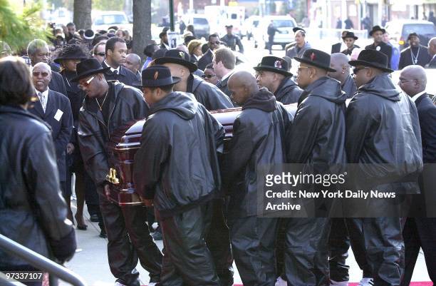 Pallbearers wearing trademark fedoras carry coffin of slain rap pioneer Jam Master Jay, Jayson Mizell into A.M.E. Cathedral , on Merrick Blvd. In St....