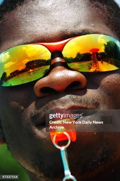 Whistle at the ready, a lifeguard keeps watch over swimmers at the Red Hook Pool on Bay St. In Brooklyn on the opening day of the city pool season.