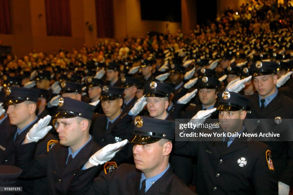 White gloves are raised to caps in unison during Fire Depart
