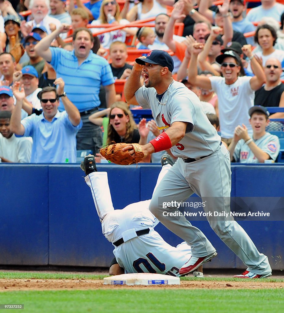 New York Mets right fielder Endy Chavez #10 tumbles after sl