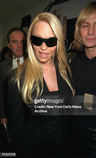 Pamela Lee Anderson backstage at the Marc Bouwer fashion show on W. 40th St. Bouwer will set out to remake Anderson's image with the clothes he will...