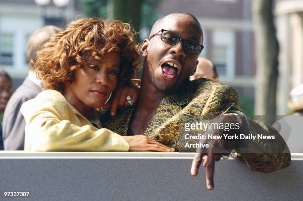Whitney Houston is joined by her husband, singer Bobby Brown, at ceremonies in East Orange, N.J., where the Franklin School was renamed the Whitney...