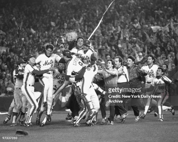 Pandemonium, like the New York Mets, reigns at Shea Stadium after the final out of the 1986 World Series. Mets defeated the Red Sox, 8-5, in Game...