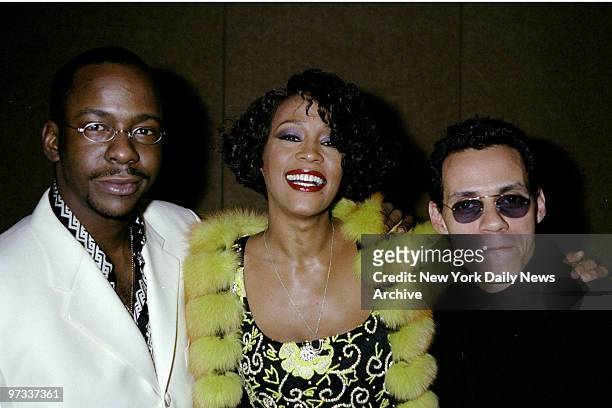 Whitney Houston with Bobby Brown and Marc Anthony attending Houston's All Star Holiday Gala at the Marriott Marquis.