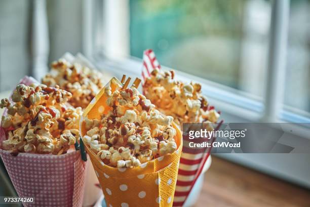 homemade salted caramel popcorn - caramel corn stock pictures, royalty-free photos & images