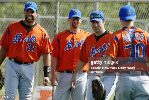 Who's on first? Mike Piazza, Jason Phillips and Todd Zeile - ready to work out out at first base - chat with catcher Justin Huber at the New York...