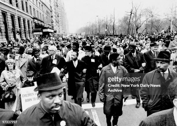 Dr. Benjamin Spock and Rev. Martin Luther King protest against the Vietnam War along Central Park West.