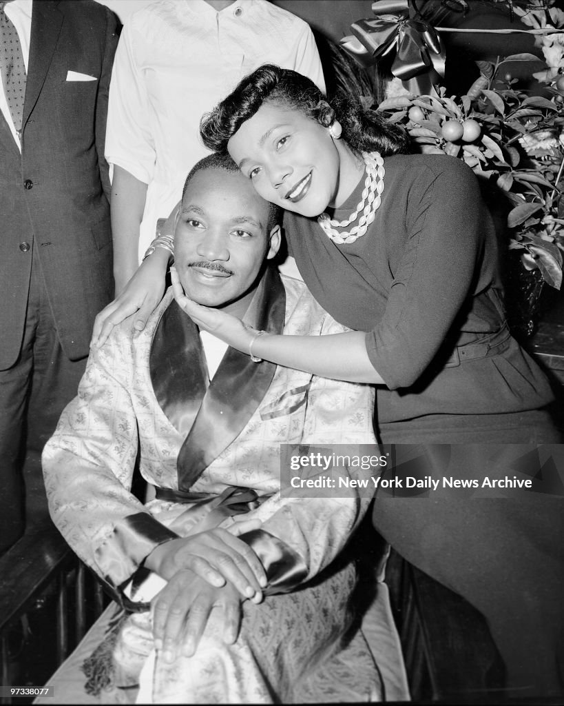 Dr. Martin Luther King and his wife, Coretta, are smiling an