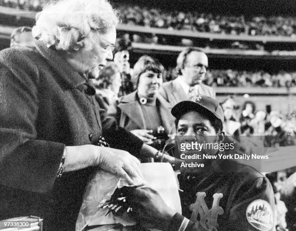 Willie Mays weeps as he is is bid farewell by New York Mets' owner Joan Whitney Payson during ceremonies for Mays at Shea Stadium. Mays retired from...