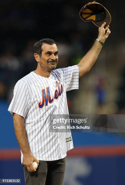 Emmy Award winning actor Ty Burrell throws out the first pitch before a game between the New York Yankees and New York Mets at Citi Field on June 10,...