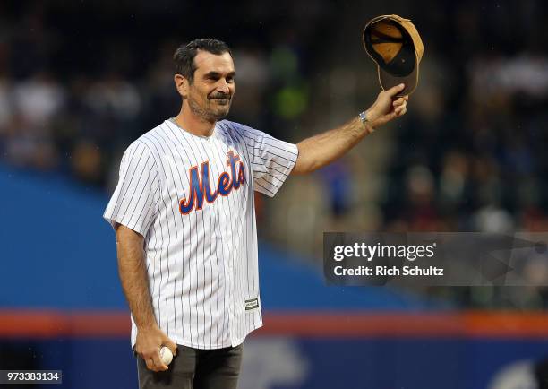 Emmy Award winning actor Ty Burrell throws out the first pitch before a game between the New York Yankees and New York Mets at Citi Field on June 10,...