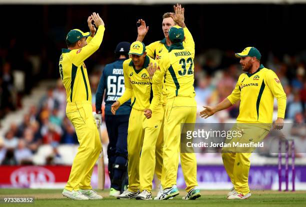 Billy Stanlake of Australia celebrates with his teammates after dismissing Joe Root of England during the 1st Royal London ODI match between England...