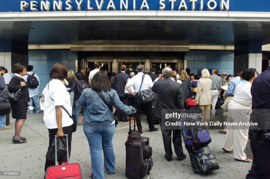 Passengers are forced to wait outside Penn Station at Eighth
