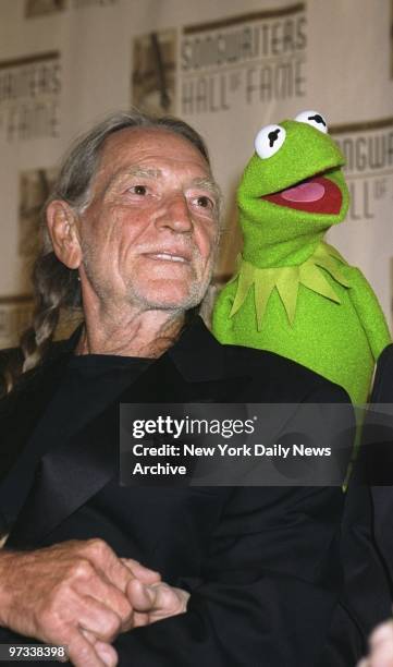 Willie Nelson is serenaded by Kermit the Frog at the Songwriters Hall of Fame's annual induction ceremonies at the Sheraton Hotel. Nelson was among...