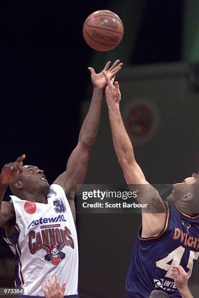 Demetrius Montgomery of the Cannons and Simon Dwight of the Razorbacks compete for the ball during the West Sydney Razorbacks v Canberra Cannons NBL...