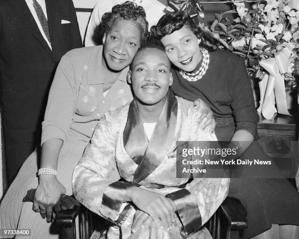 Dr. Martin Luther King with his mother and his wife, Coretta, are smiling and cheerful druing their interview yesterday in Harlem Hospital after...