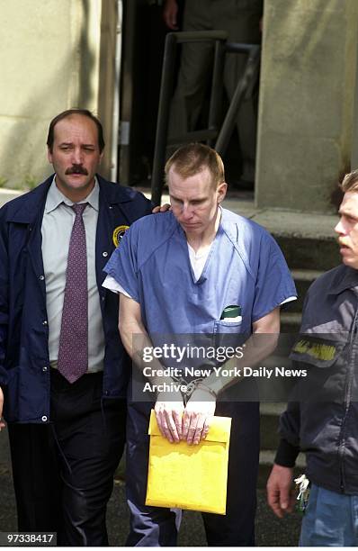 Dr. Michael Swango is led out of U.S. District Court in Uniondale, L.I., after pleading not guilty to charges that he murdered three retired veterans...