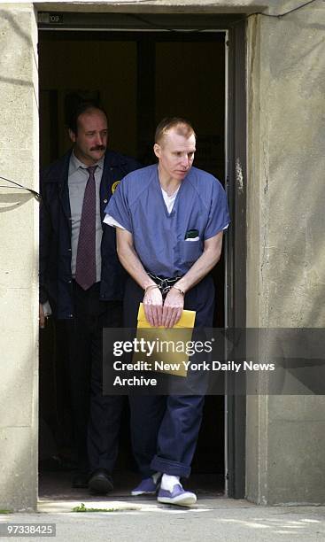 Dr. Michael Swango is led out of U.S. District Court in Uniondale, L.I., after pleading not guilty to charges that he murdered three retired veterans...