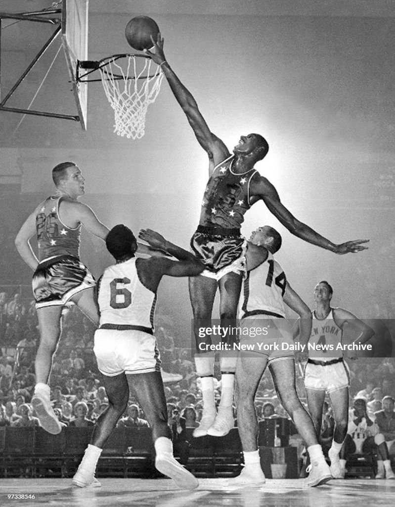 Wilt Chamberlain taps in a rebound for the All-Stars against