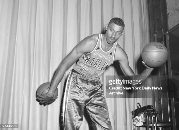 Wilt Chamberlain, formerly with the University of Kansas, at Toots Shor's. Chamberlain signed with the Harlem Globetrotters for a salary of $65,000 a...