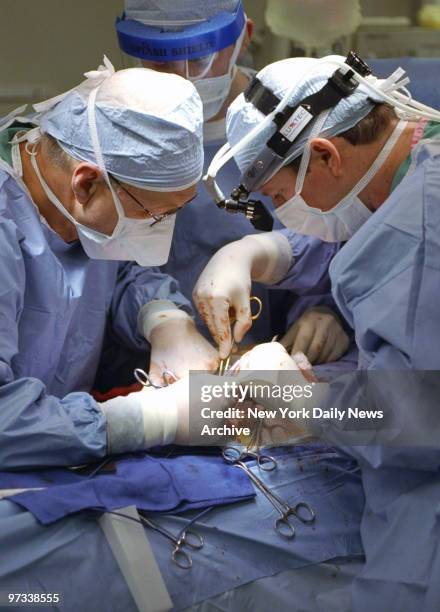 Dr. William Stubenbord and Dr. Alister Phillips transplant the kidney of Simon Fink into his wife, Ronni, at New York Presbyterian Hospital.